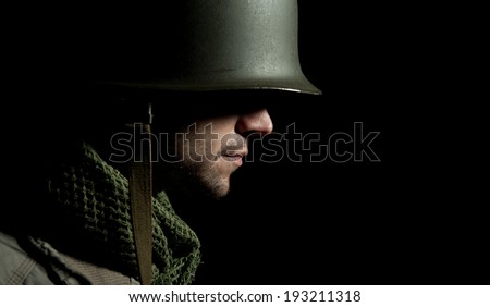 WW2 American Soldier With Face In Deep Shadow