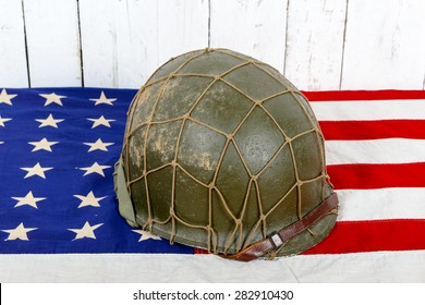 Wwii Military Helmet On American Flag