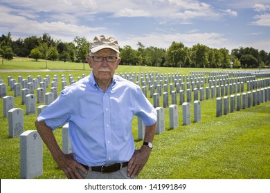 WWII Veteran Among The Headstones At A Military Cemetery