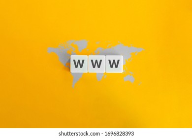 WWW (World Wide Web) On Block Letters. Grey World Map On Bright Orange Background. Minimal Aesthetics.