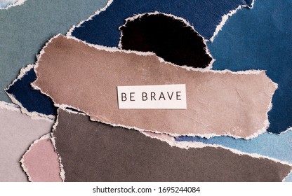 wycinanka, kolorowy kolaż artystyczny z napisem "be brave" - Shutterstock ID 1695244084