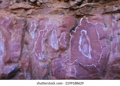 WYNDHAM, WA - AUG 12 2022:Australian Aboriginal Mythology Of Human Figures Rock Paintings On A Rock Cave In Kimberley Western Australia.