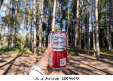 Wyoming, USA - July 19, 2022: Hand Holds Up A Coca-Cola Zero Sugar Can Of Soda Pop, With The Nutrition Facts Information Panel Showing