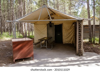 Wyoming, USA - June 26, 2021: Rustic Tent Cabins At Colter Bay Village, With Picnic Table And A Bear Box, At Grand Teton National Park