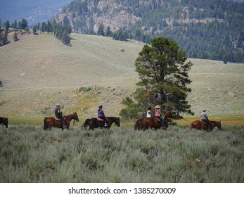 Wyoming, USA--July 2018: People On Horses Horseback Riding Is One Of The Popular Activities For Tourists At Yellowstone National Park.