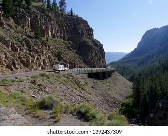 Wyoming, USA--July 2018: Trucks Drive Through The Historic Golden Gate Canyon Bridge At Grand Loop Road, Yellowstone National Park.