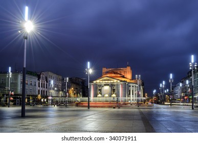 Wyspianski Theatre on the central square of the Katowice, and the tram in the evening. Poland