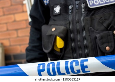 Wythenshawe, Manchester - 10th Sept 2019 Police Officer Behind Police Tape With A Taser.