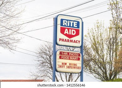 Wytheville, USA - April 19, 2018: Road Street During Day In City With Rite Aid Pharmacy Store And Sign For One Hour Photo Food Mart Now Hiring