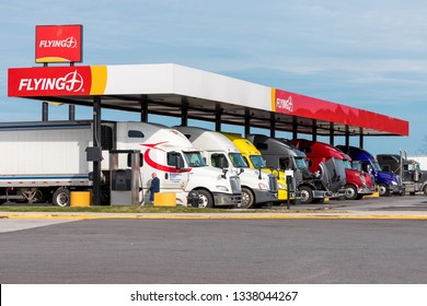 Wytheville VA/USA-March 12, 2019 Pilot Flying J Truck Stop fuel island full of tractor trailers. This station is located on Interestate 81 / 77 in Southwest Virginia.