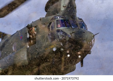 WYTON, CAMBRIDGESHIRE, UK – AUGUST 31, 2017: Kicking Up A Maelstrom Of Grass Cuttings, Royal Air Force 18 Squadron Boeing Vertol CH-47D Chinook HC2A ZH892 Flies Into RAF Wyton, In Cambridgeshire.
