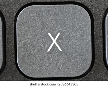 X Button keycaps on light gray keyboard