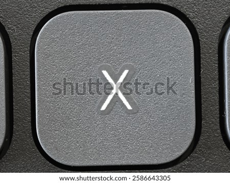 X Button keycaps on light gray keyboard