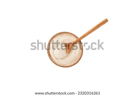 Xanthan Gum Powder in wooden bowl on white background, top view. Food additive E415. Water Soluble powder. Binding agent, Gluten free ingredient. Stabiliser, Thickener.