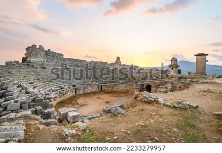 Xanthos Ancient City. Grave monument and the ruins of ancient city of Xanthos - Letoon in Kas, Antalya, Turkey at sunset. Capital of Lycia.