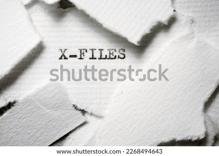 The x-files text written on a small piece of paper
