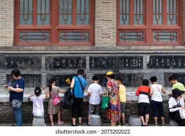 Xi'an, China - July 17, 2021: Pupils Copying Caligraphy In Stele Forest Or Beilin Museum, Xi'an, Shaanxi, For Steles And Stone Sculptures Of Chinese Caligraphy, Paiting And Historic Records.