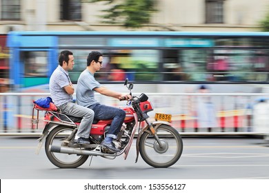 2 men on a bike