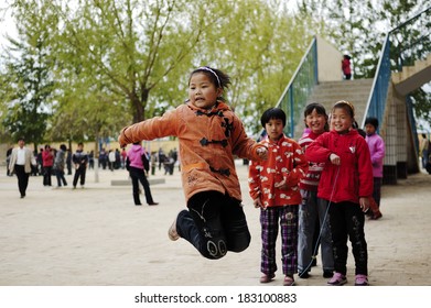 Xingtai City, China - November 2010: In The November 10, 2010, Baixiang County School Classrooms, Unidentified Students During Recess Happy To Do Skipping Games.