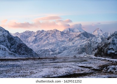 Xinjiang China Pamir Plateau snow mountain in winter. Sun rise morning landscape. - Powered by Shutterstock