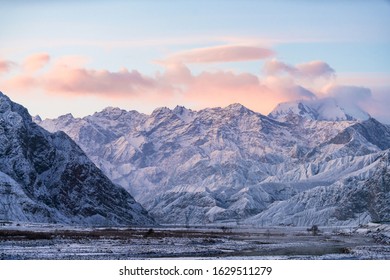 Xinjiang China Pamir Plateau snow mountain in winter. Sun rise morning landscape. - Powered by Shutterstock