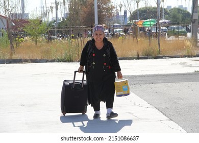 Xinjinag, China- 09-18-2011: A Kazakh female passenger at the border crossing between China and Kazakhstan.