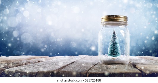 Xmas Concept - Snowy Christmas Tree In Jar