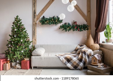 Xmas In Morning Living Room. Sofa Bed In Christmas Interior. Celebrate The New Year And Holidays. Christmas Tree And Gingerbread House