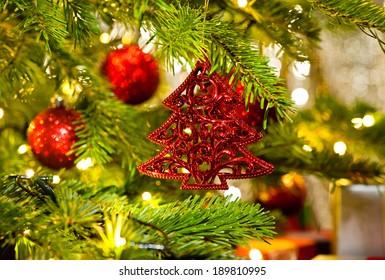 Xmas Ornament In A Real Christmas Tree In Bright Color