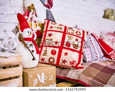 Xmas pillows with cover, Snowman and stars decor. New Year's card scenery. Christmas concept.