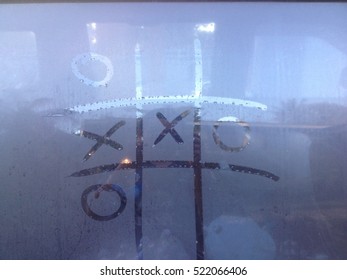 XO Game Of Tic Tac Toe Game On The Window Car.