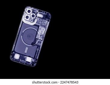 An x-ray of a mobile phone shows the internal parts of the device. - Shutterstock ID 2247478543