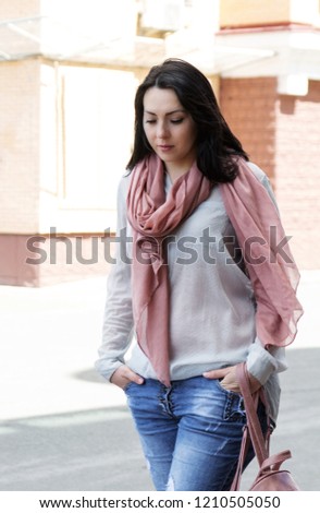xxl woman portrait street style, beautiful young girl plus-size in casual clothes outdoors on the street of the city