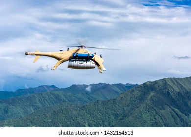 YaAn, Sichuan / China - Drone Delivery By China Post Seen In The Rural Area Of Sichuan. Drone Is Becoming A Core Strategy For China To Fight Poverty And Expand ECommerce.