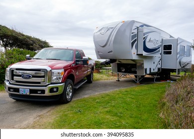 YACHATS, OR - MARCH 19, 2016: Campsite with a large Arctic Fox 5th Wheel and a Ford F350 truck.