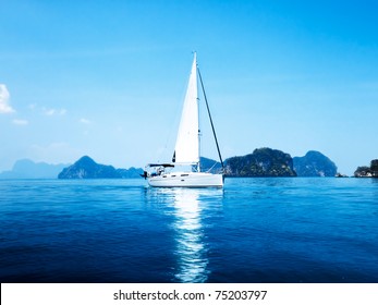 yacht and blue water ocean