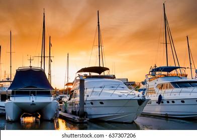 Yacht and boats docking at the marina in the evening, Phuket, Thailand - Powered by Shutterstock