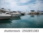 Yacht club and marina long view. Luxurious yacht marina. Yacht parking in harbor, harbor yacht club Beautiful Yachts in blue sky background.