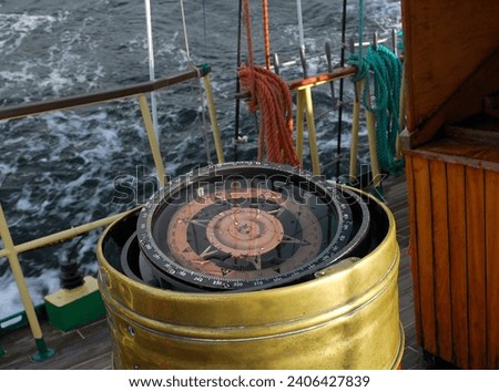 A yacht compass in a brass casing.
