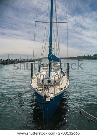 Yacht With Complex Rigging Moored vert