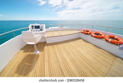 Yacht flybridge open deck, modern and luxury equipped with navigation dashboard devices. Lifestyle freedom concept.