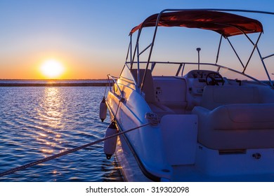 Yacht near the pier against sunset, summer vacation concept