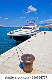 Yacht On Mooring Bollard Dock Vertical View