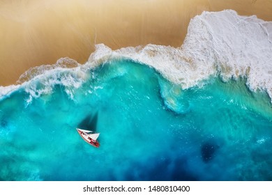 Yacht on the sea from top view. Turquoise water background from top view. Beach and waves. Summer seascape from air. Travel - image - Shutterstock ID 1480810400