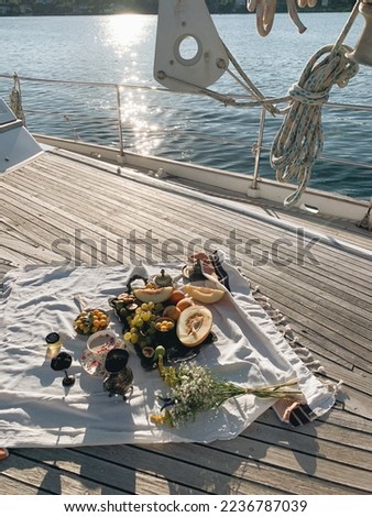 yacht party picnic, traveller enjoying a picnic lunch on yacht boat 