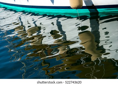 A Yacht And Its Reflection In St Tropez Harbour