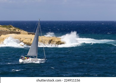 Yacht In Rough Seas On A Sunny Day