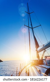 Yacht Sailing against sunset. Sailboat. Yachting. Sailing Travel Concept Vacation