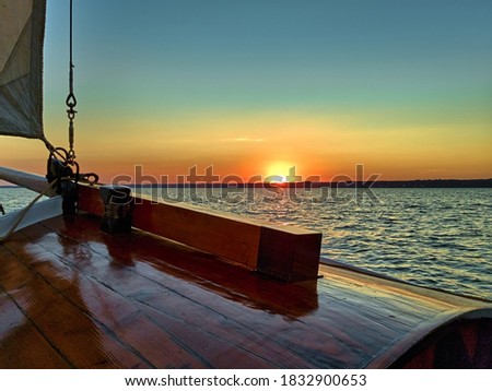 Yacht sailing at beautiful sunset. Zdjęcia stock © 