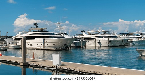 Yacht at sea port. Luxury boat motor yacht in marina on Biscayne Bay. Sailboat moored to pier in yacht marina. Sailing and yachting tourism. Luxury lifestyle. Vacations on summer. South beach - Powered by Shutterstock